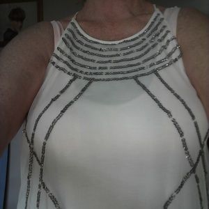 white blouse with silver sequins.